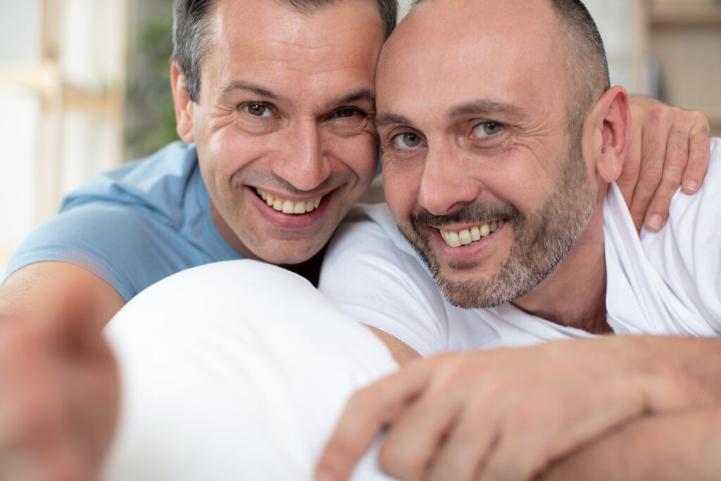 male couple smiling