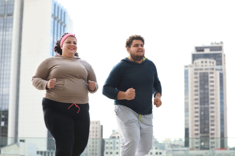 couple exercising together in city